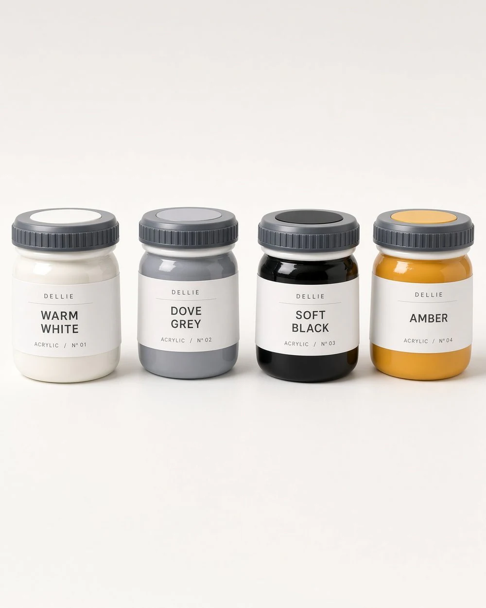 Four pots of Dellie acrylic paint, labelled warm white, dove grey, soft black and amber